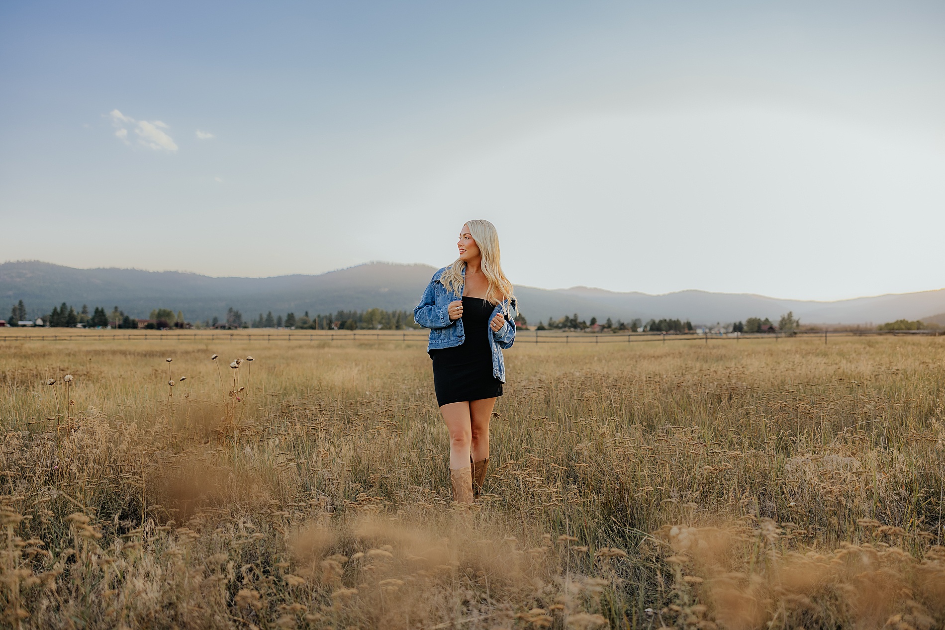 woman in black dress and jean jacket 