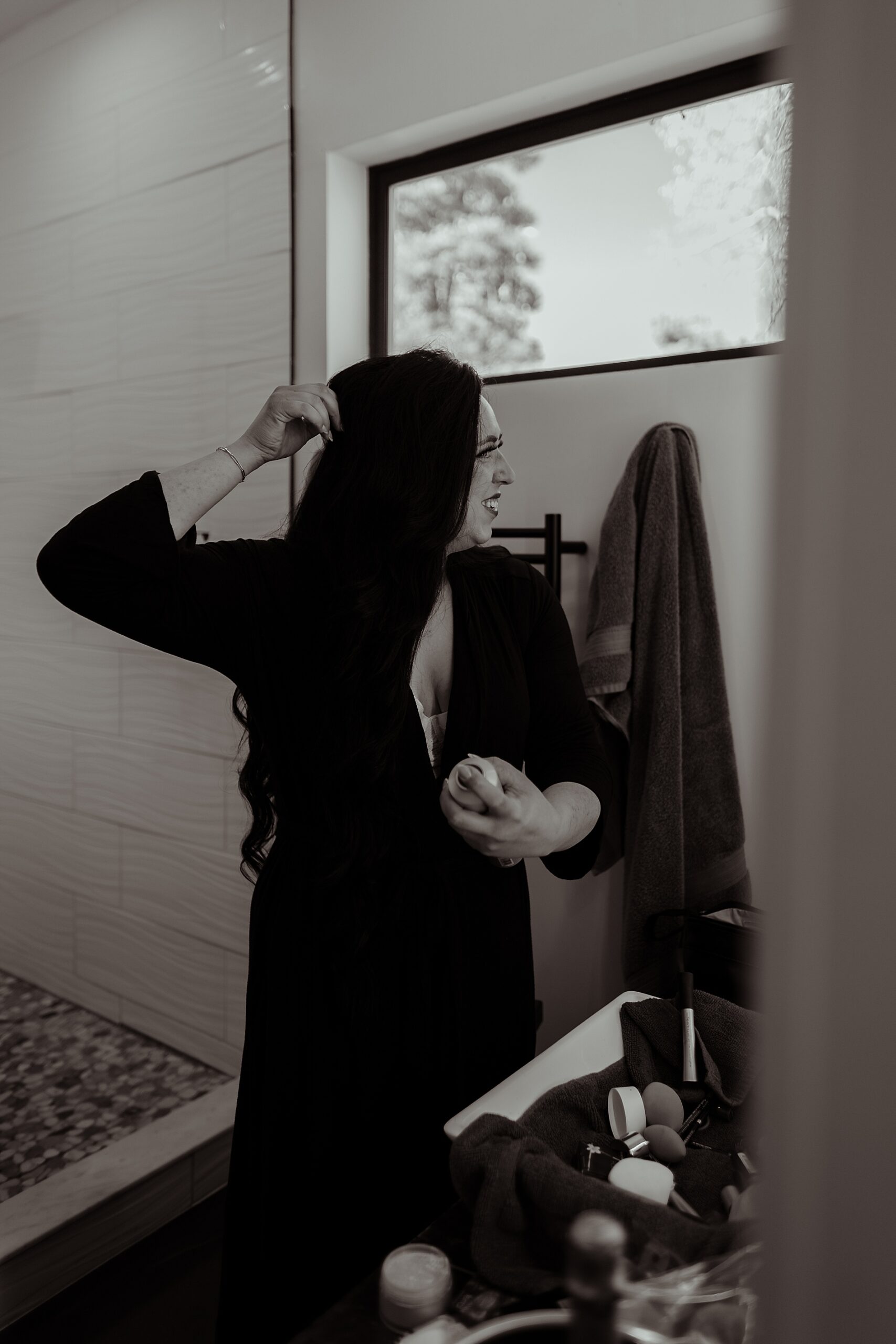 bride doing hair before Intimate Angel Fire, NM Micro Wedding