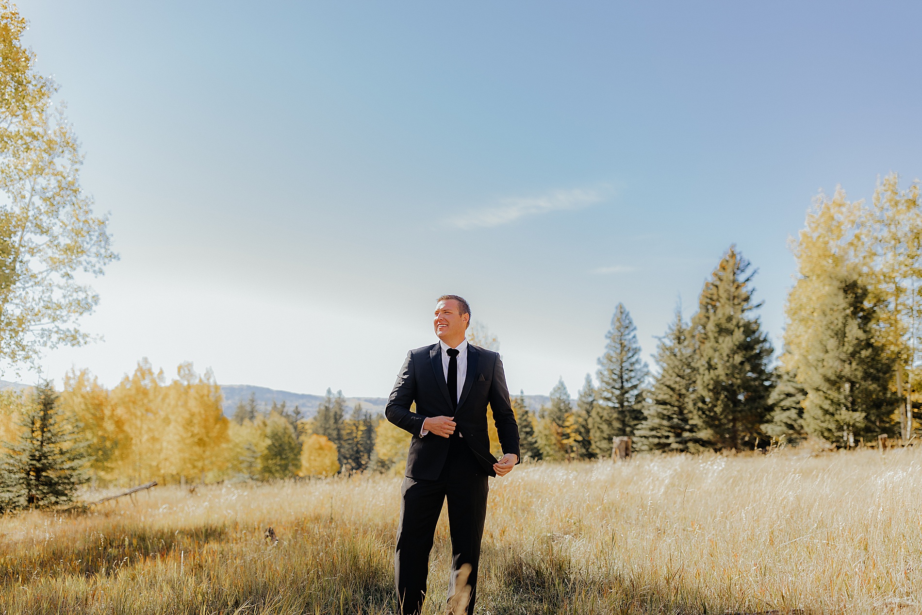 groom photos on hilltop 