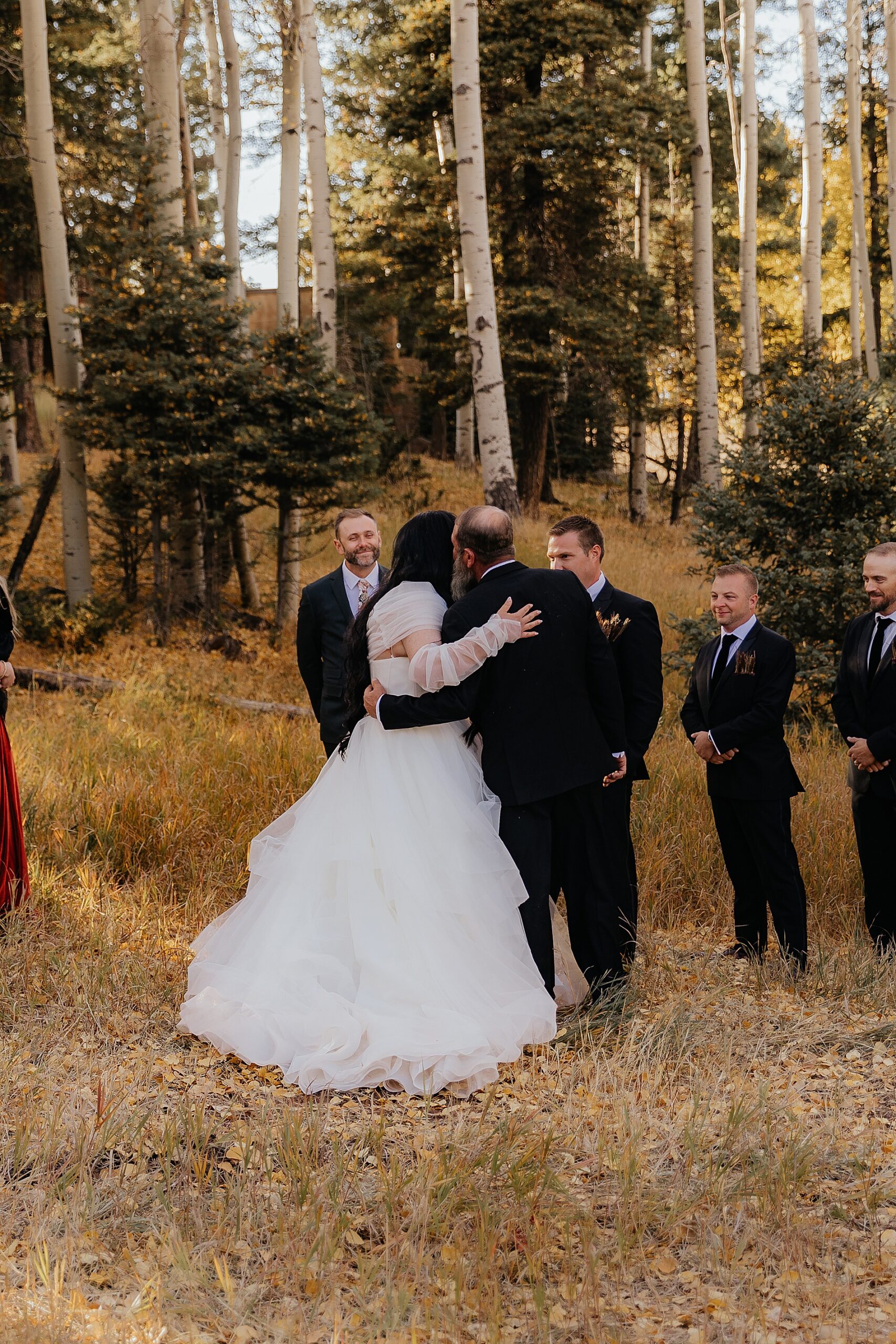 father giving bride away at wedding ceremony