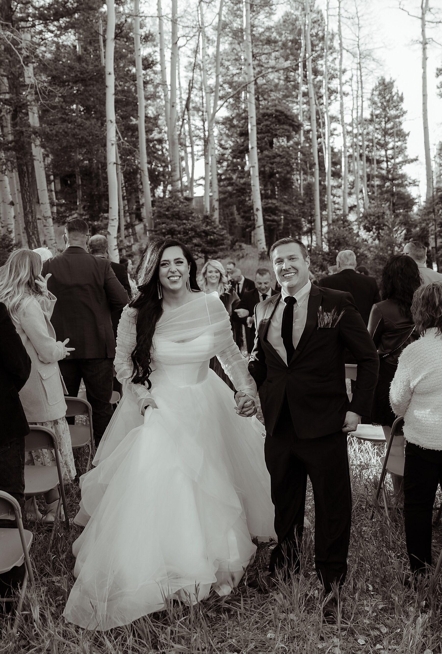 joyful wedding photos of newlyweds exiting ceremony