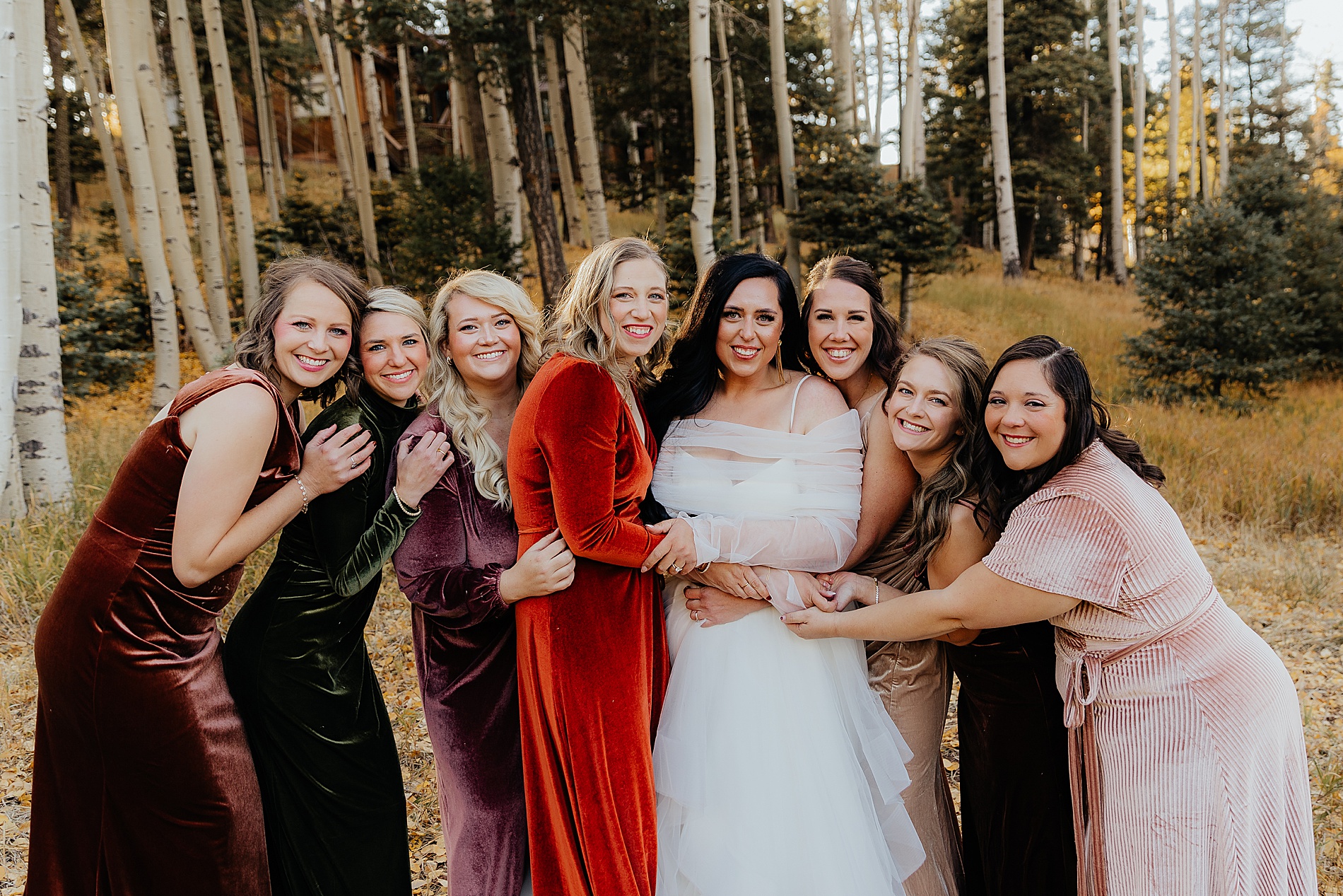 bridesmaids hug bride