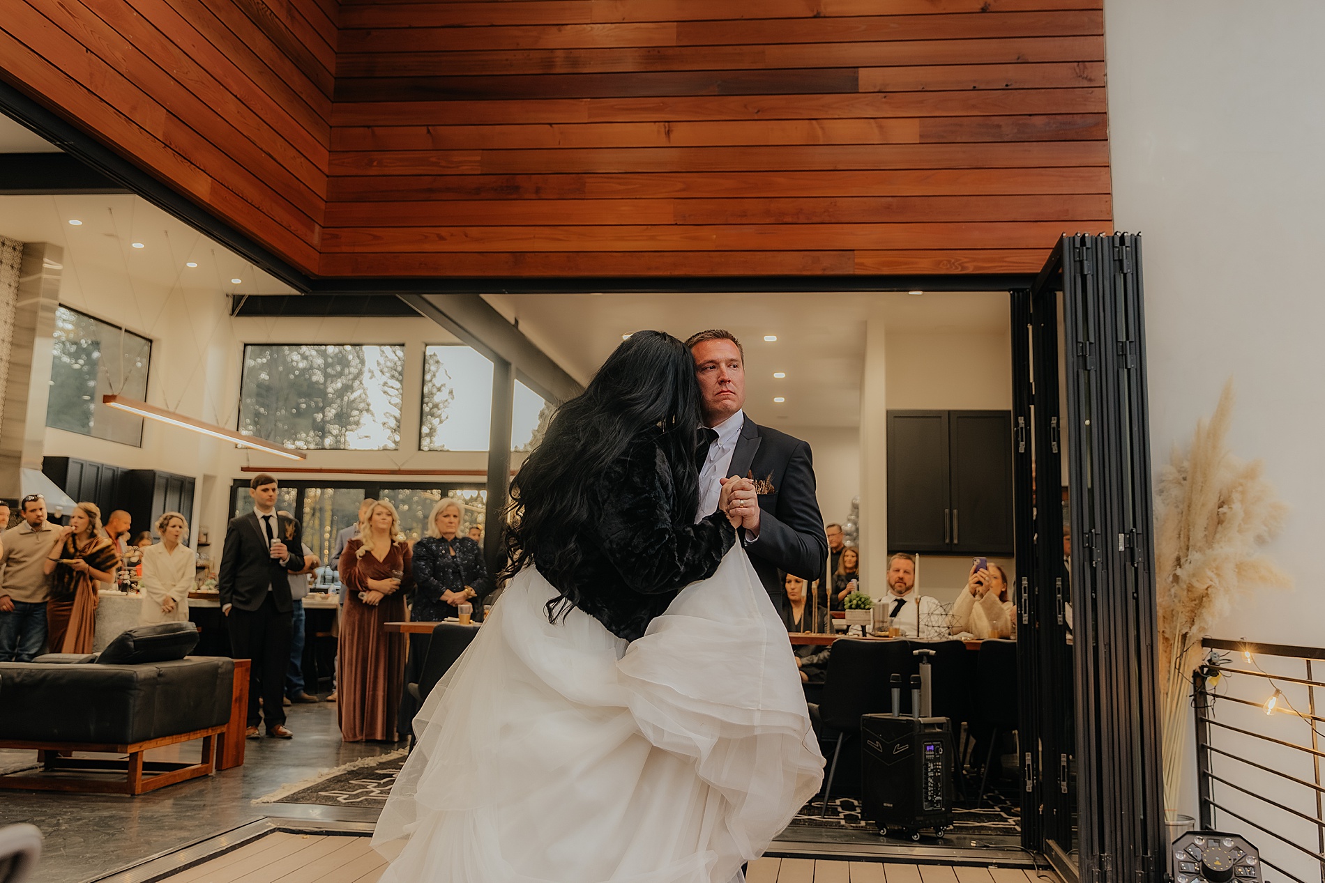 newlyweds enjoying first dance on patio 