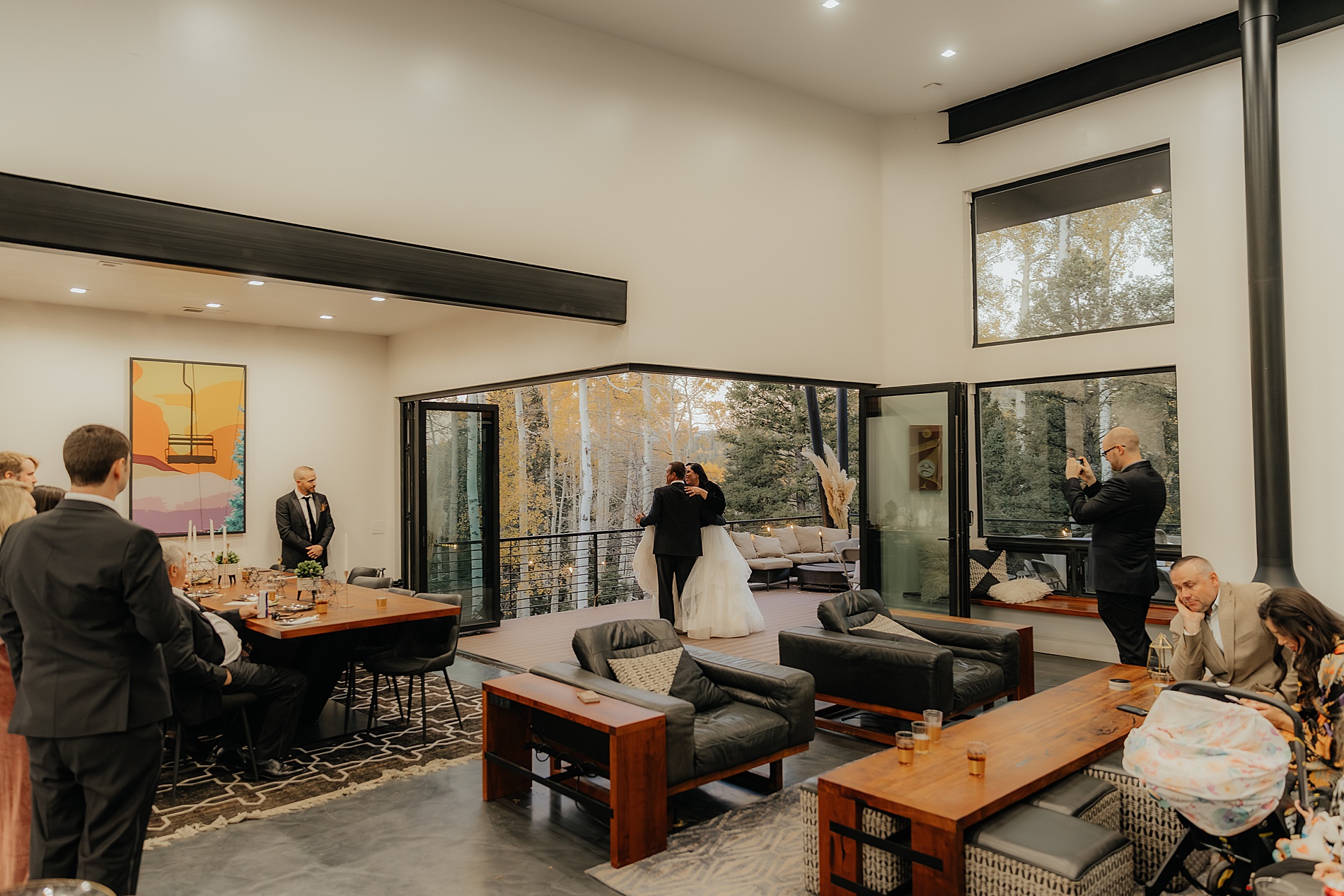 guests look on as couple enjoy first dance together on patio