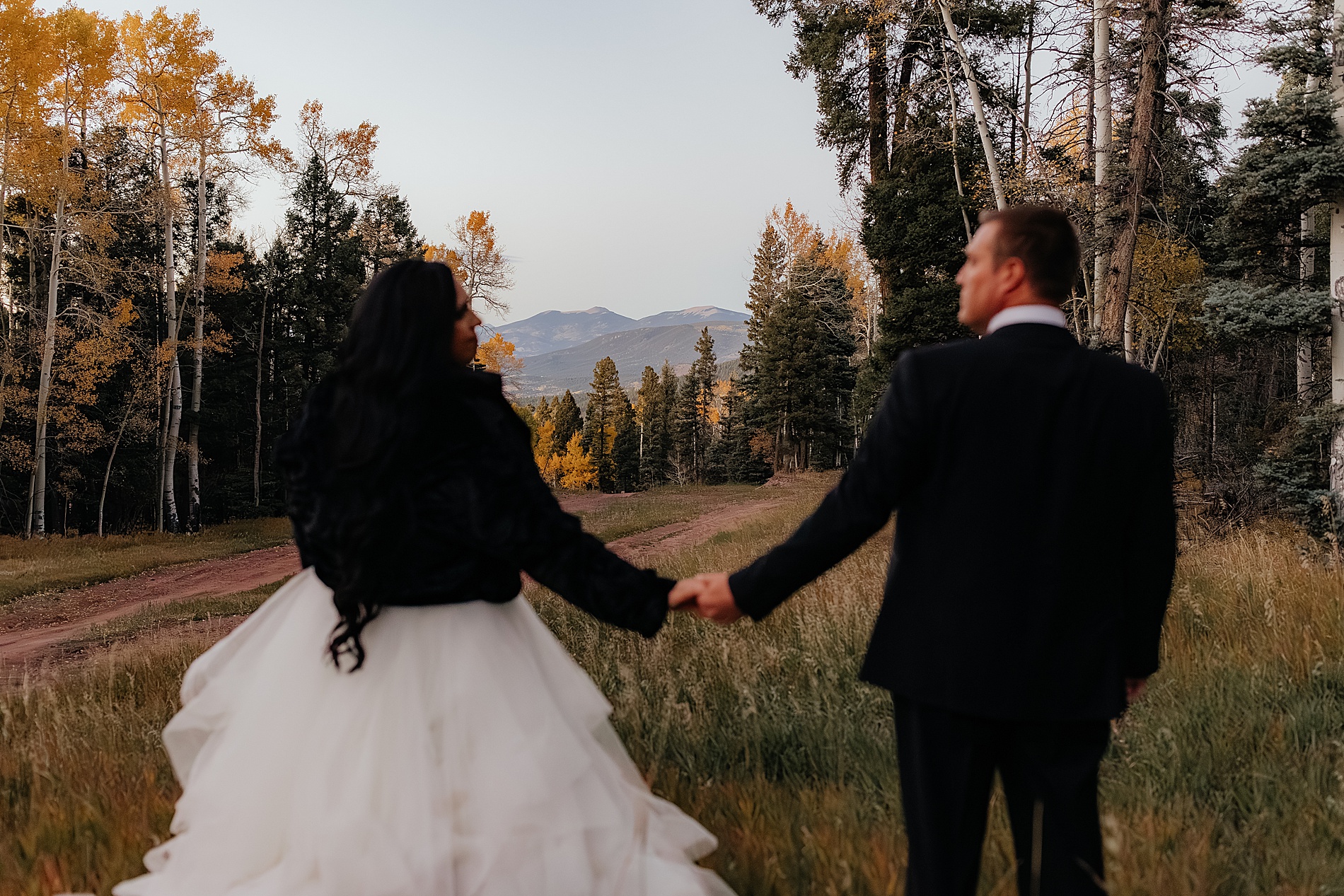 bride and groom holds during newlywed photos