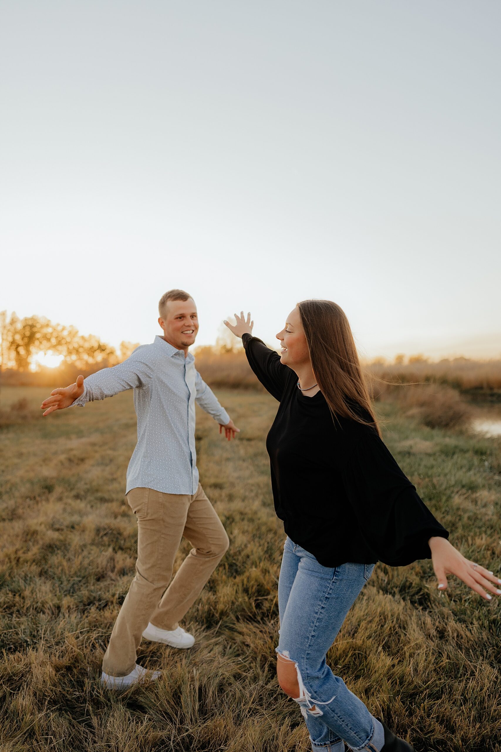 couple having fun dancing and being goofy during Candid and Fun Engagement Session