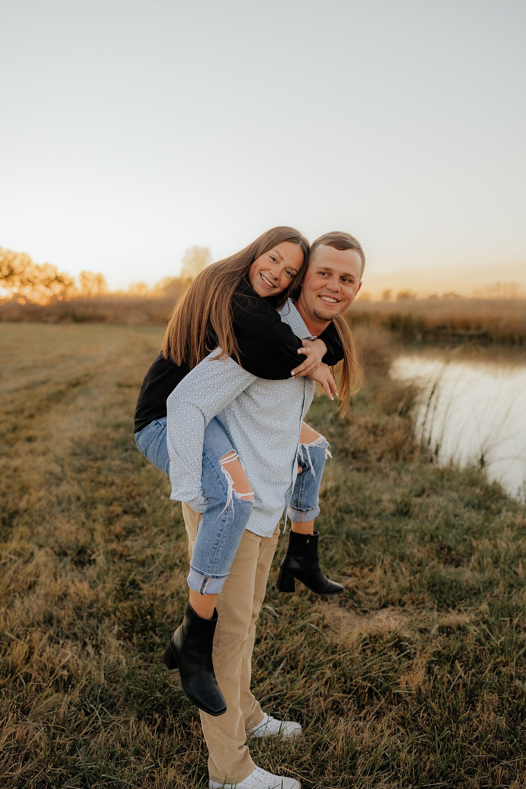 Man carries fiance on his back