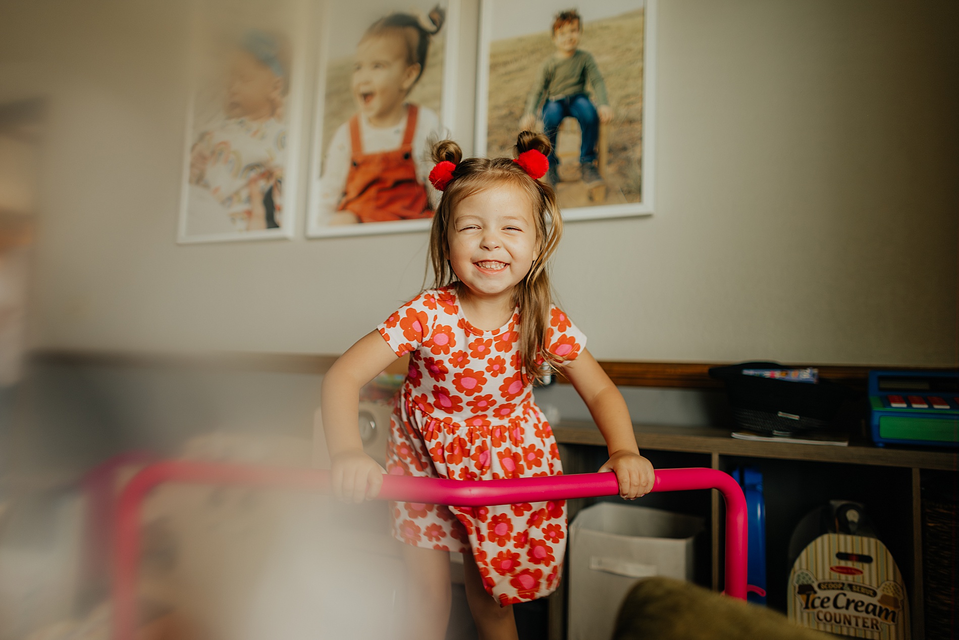 little girl laughs during candid in-home session