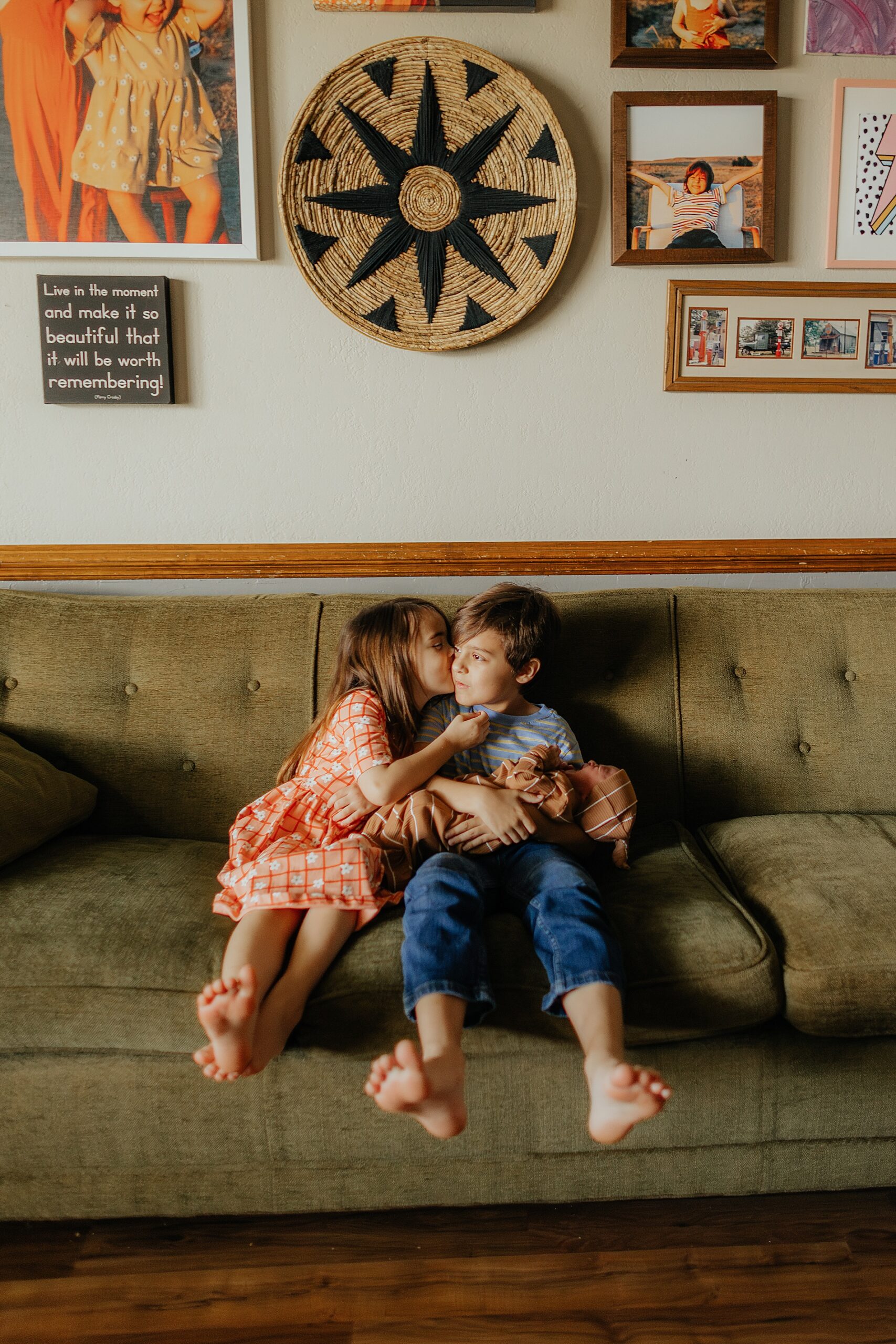 big brother holds little brother while sister kiss broth on cheek | The Beauty of Candid Lifestyle Photography