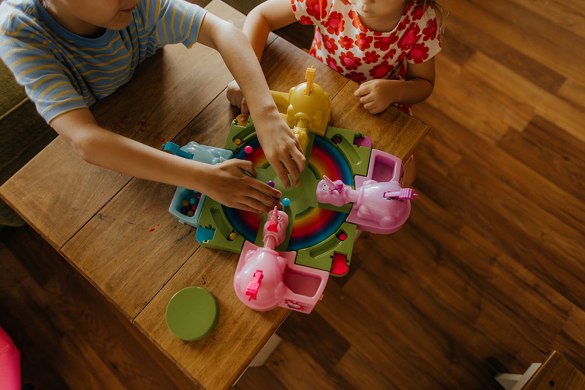 brother and sister play Hungry Hungry Hippos | The Beauty of Candid Lifestyle Photography