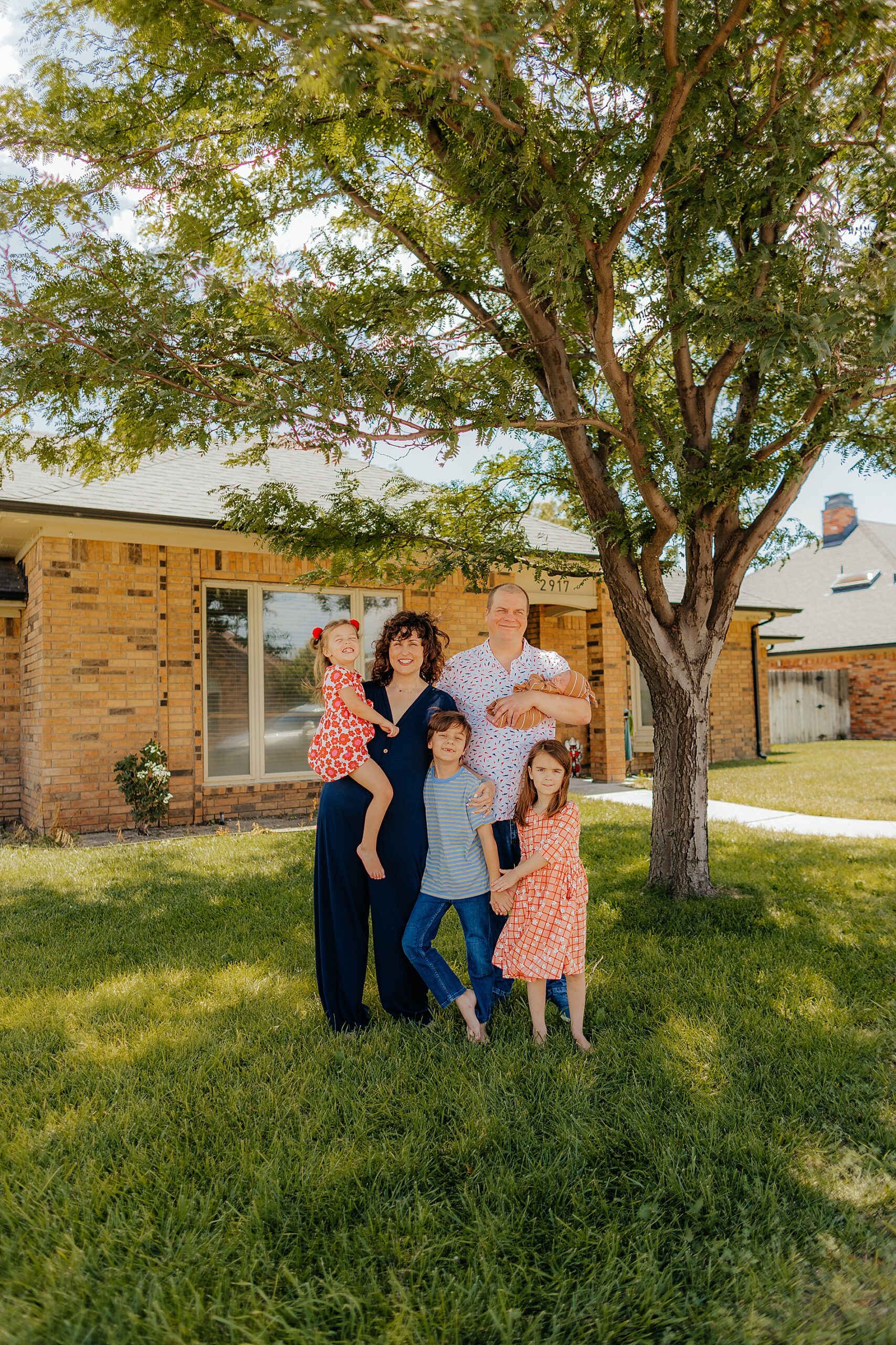 Family of 6 outside of house