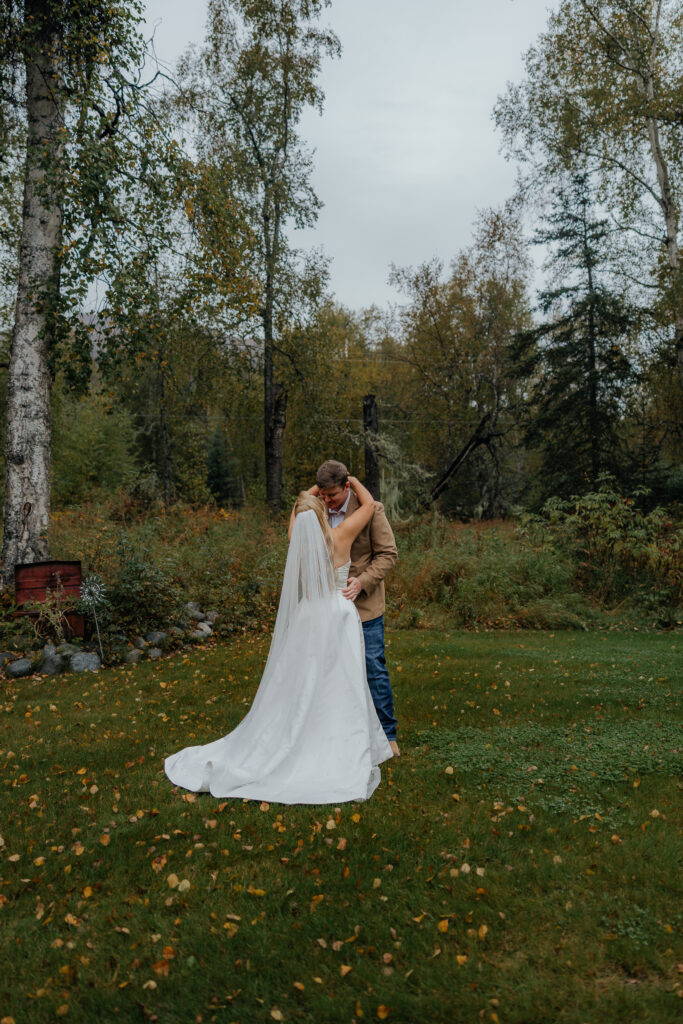 Bride and groom's first look their Knik Glacier helicopter elopement.